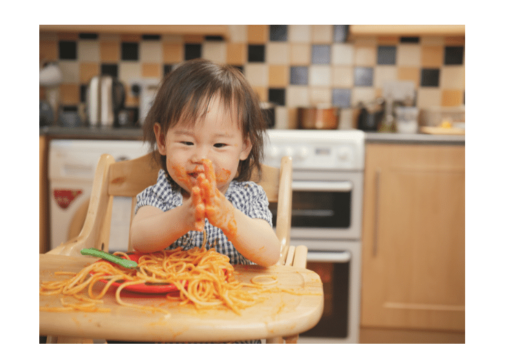 babies eating spaghetti